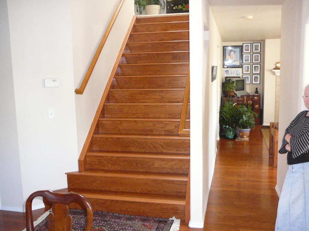 Formerly carpeted stairs. Replace carpet with Bruce hardwood flooring , Treads, risers, skirts and skirt topper. Stained and varnished skirt topper to match factory finish. I also did the floors in the living room, den & hallway.